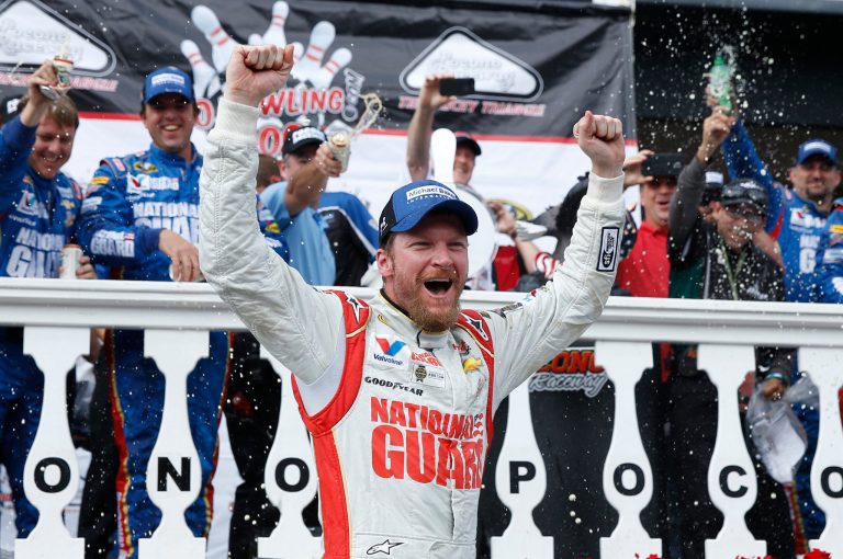 Dale Earnhardt Jr. celebrates in Victory Lane after winning the NASCAR Sprint Cup Series auto race at Pocono Raceway, Sunday, Aug. 3, 2014, in Long Pond, Pa. (AP Photo/Matt Slocum)