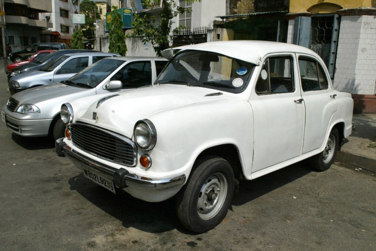 A Hindustan Motors Ambassador is parked with other vehicles in Calcutta, India, Wednesday, May 2, 2007. (AP Photo/Bikas Das)