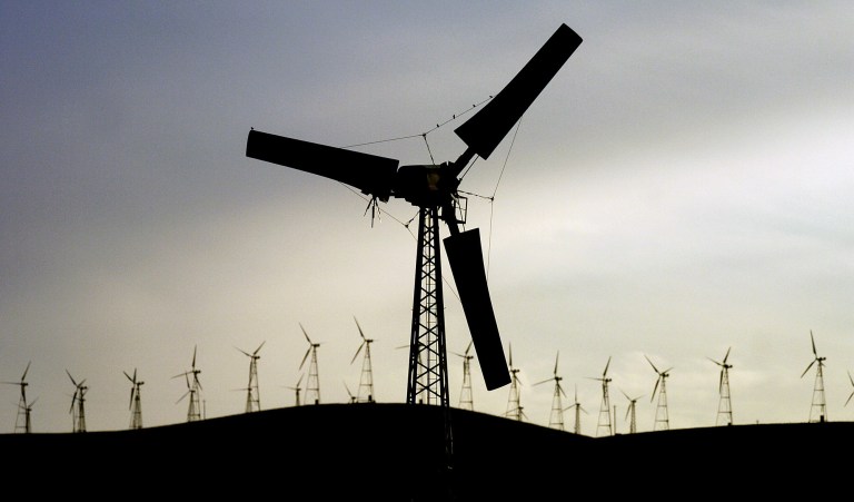 A deal was struck with Democrats to get the ban lifted by agreeing to extend a wind production tax credit for five years in a related tax package released at the same time. (Noah Berger/Bloomberg News)