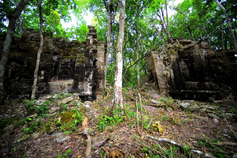 In this Oct. 28, 2013 image released by Mexico's National Institute of Anthropology and History (INAH) on Monday Aug. 25, 2014, ruins belonging to an ancient Maya city called Lagunita stand out in the jungle on a remote location in the southern state of Campeche, Mexico. Archaeologists in Mexico have made public the existence of an ancient Maya city in the state of Campeche and have rediscovered this forest-covered site that first was stumbled upon in the 1970s. The INAH says the discoveries will help archaeologists study the cultural and political histories of an area known as the Central Lowlands of the Maya region. (AP Photo/INAH, Mauricio Marat)