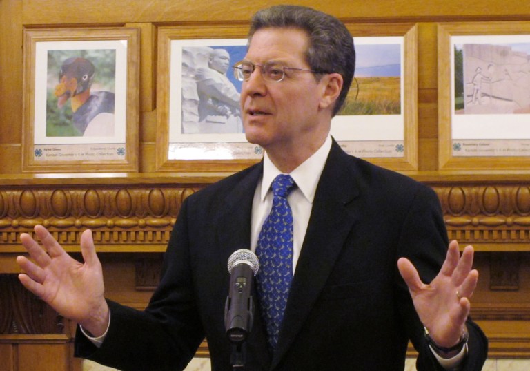Kansas is joining a proposed compact with other states that hope to exempt themselves from the federal health care overhaul, and Republican Gov. Sam Brownback on Wednesday rejected criticism that the move will jeopardize seniors' benefits. (AP Photo/John Hanna)