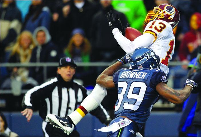 Anthony Armstrong #13 of the Washington Redskins makes a touchdown catch against Brandon Browner #39 of the Seattle Seahawks on November 27, 2011 at CenturyLink Field in Seattle, Washington.