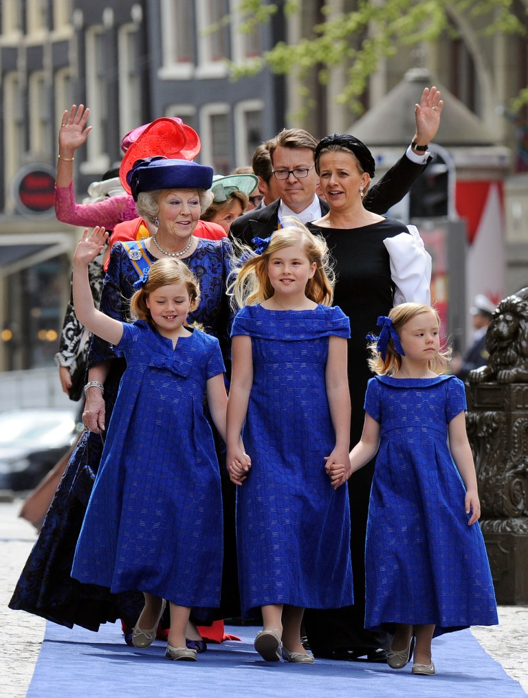 Dutch Princess Beatrix arrives with her granddaughters Alexia, Catharina-Amalia and Ariane, from left, at the Nieuwe Kerk or New Church in Amsterdam, The Netherlands, for the inauguration of King Willem-Alexander Tuesday April 30, 2013. Around a million people are expected to descend on the Dutch capital for a huge street party to celebrate the first new Dutch monarch in 33 years. (AP Photo/Toussaint Kluiters, Pool)