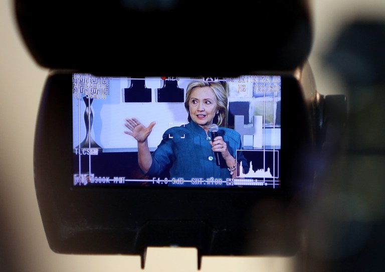 Democratic presidential hopeful Hillary Clinton is seen through a video camera as she speaks to supporters during a campaign event. (John Lovretta/The Hawk Eye via AP)