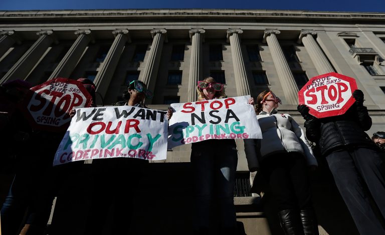 Activists protest the surveillance of U.S. citizens by the NSA outside the Justice Department where U.S. President Barack Obama gave a major speech on reforming the NSA January 17, 2014 in Washington, DC. (Photo by Win McNamee/Getty Images)