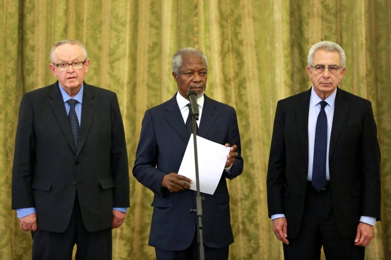 Kofi Annan, former U.N secretary general, center, reads a statement at the conclusion of his meeting with Iran's Foreign Minister Mohammad Javad Zarif  in Tehran, Iran, Monday, Jan. 27, 2014, with Martti Ahtisaari, former president of Finland, left, and Ernesto Zedillo, Mexican ex-president, right. The former head of the United Nations urged Iran Monday to build on a historic deal reached with world powers in November and work toward a final settlement over its contested nuclear program. Annan, who is heading a group of ex-world leaders known as 