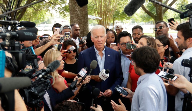 Democratic presidential candidate former Vice President Joe Biden, center, speaks to members of the media following a visit with students on the campus of Texas Southern University Friday, Sept. 13, 2019, in Houston.