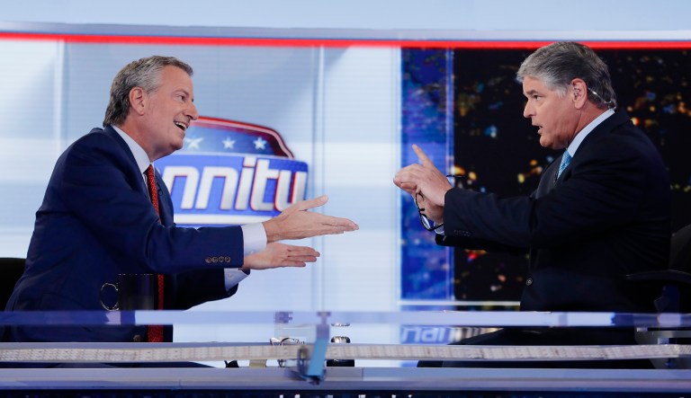 Fox News host Sean Hannity, right, interviews Democratic presidential candidate and New York Mayor Bill de Blasio during a taping of his show, "Hannity," Wednesday, Aug. 7, 2019, in New York.