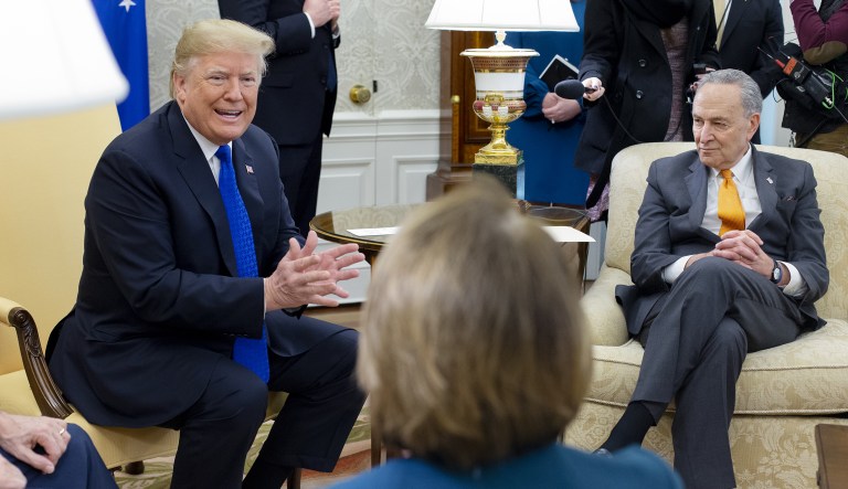 U.S. President Donald Trump, speaks while House Minority Leader Nancy Pelosi, a Democrat from California, center, and Senate Minority Leader Chuck Schumer, a Democrat from New York, listen during a meeting at the Oval Office of the White House in Washington, D.C., U.S., on Tuesday, Dec. 11, 2018. If TrumpÂ sticks to his demand for $5 billion in funding for a wall on the U.S. border with Mexico, he will get no wall and a shutdown, Schumer told reporters after the meeting.