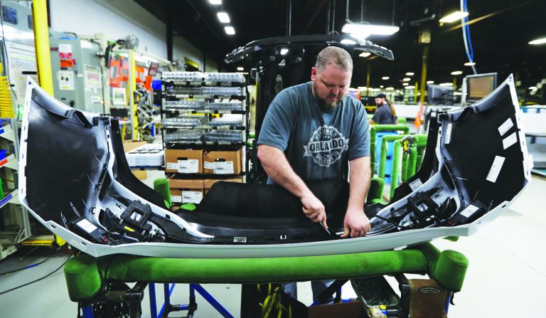 Machine operator Ed Lloyd works on the rear end of a General Motors Chevrolet Cruze at Jamestown Industries, Wednesday, Nov. 28, 2018, in Youngstown, Ohio. Jamestown Industries supplies parts for the Chevy Cruze. GM said Monday that Lordstown will stop making the Chevy Cruze by March, at a cost of 1,400 union jobs on top of the 2,700 lost there since President Donald Trump took office. (AP Photo/Tony Dejak)