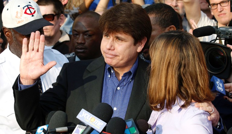 FILE - In this March 14, 2012 file photo, former Illinois Gov. Rod Blagojevich, with his wife Patti at his side, speaks to the media in Chicago before reporting to federal prison in Denver. President Donald Trump says he is considering commuting the sentence of ex- Gov. Blagojevich and pardoning Martha Stewart. The comments came aboard Air Force One on Thursday, May 31, 2018, after he tweeted that he planned to pardon conservative commentator Dinesh D'Souza. Blagojevich, a Democrat, began serving his 14-year prison sentence on corruption convictions in 2012.
