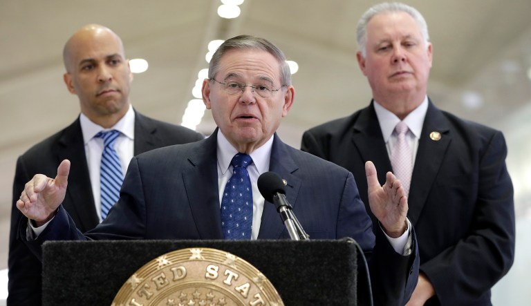 Sen. Bob Menendez, front, speaks during a news conference at Newark Liberty International Airport to address the partial government shutdown, which is keeping airport employees working without pay, Tuesday, Jan. 8, 2019, in Newark, New Jersey.