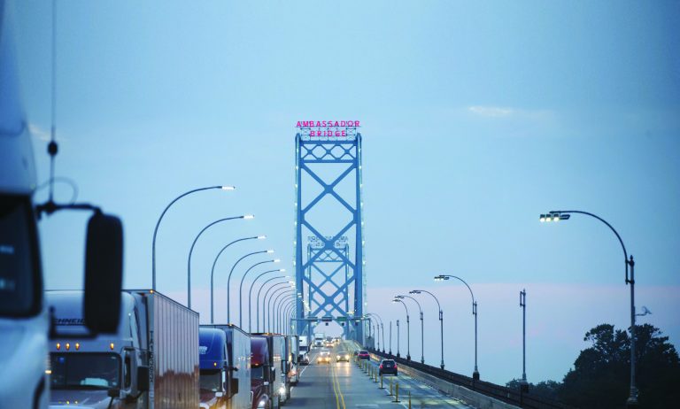 Commercial trucks and passenger vehicles drive across Ambassador Bridge on the Canada-U.S. border in Windsor, Ontario, Canada, on Thursday, Aug. 9, 2018. The Ambassador Bridge connects Canada to USA, from Windsor to Detroit and facilitates over 30% of all Canada-US road trade. Photographer: Cole Burston/Bloomberg