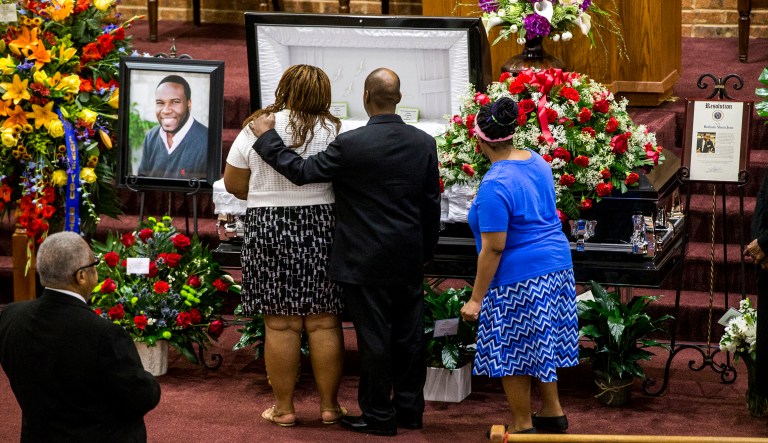 Mourners console each other during the public viewing before the funeral of Botham Shem Jean at the Greenville Avenue Church of Christ on Thursday, September 13, 2018 in Richardson, Texas. He was shot and killed by a Dallas police officer in his apartment last week in Dallas.