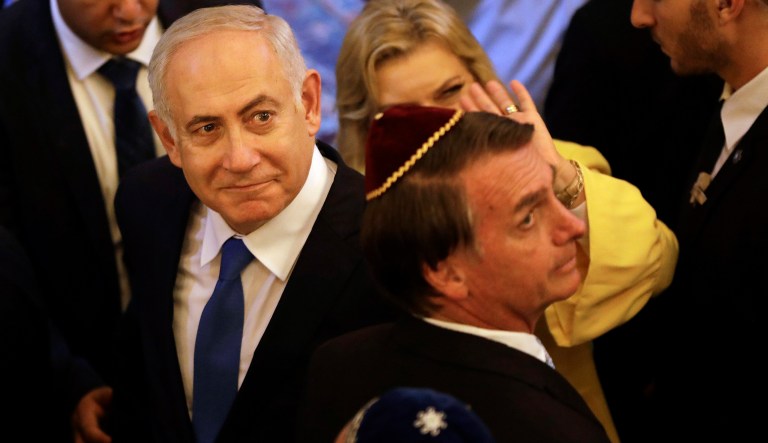 Israel's Prime Minister Benjamin Netanyahu and Brazil's President-elect Jair Bolsonaro, exit after a visit to the Kehilat Yaacov synagogue, in Rio de Janeiro, Brazil, Friday, Dec. 28, 2018. According to the Israeli Embassy, Netanyahu will stay in Rio until Tuesday, when he will travel to Brasilia for the presidential inauguration.