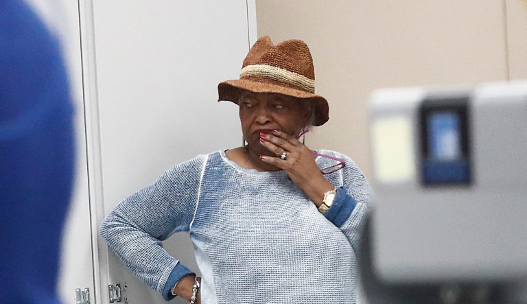 Broward County Supervisor of Elections Dr. Brenda Snipes watches as workers load ballots into machines at the Broward County Supervisor of Elections office during a recount on Sunday, Nov. 11, 2018, in Lauderhill, Fla.