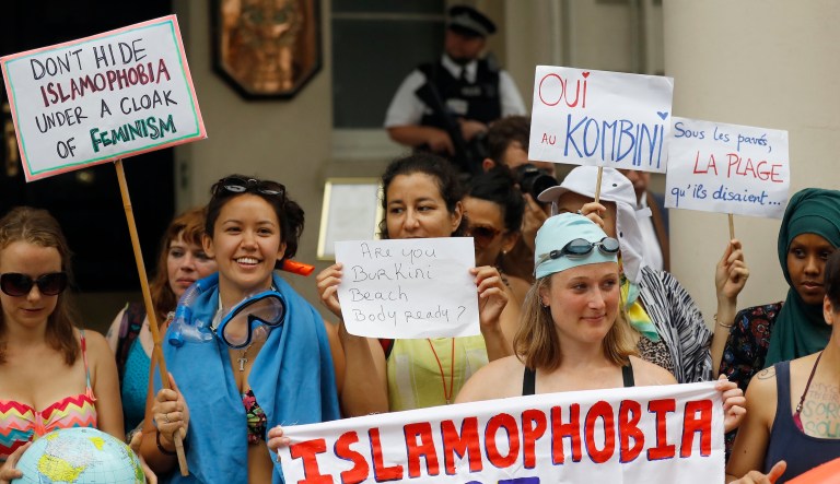 Activists protest outside the French Embassy in London against the French authorities clampdown on women who wear burkinis on Aug. 25, 2016.