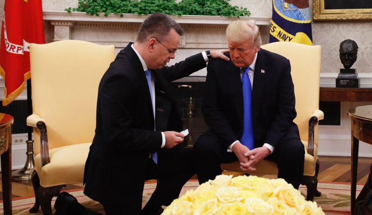 President Donald Trump prays with American pastor Andrew Brunson in the Oval Office of the White House, Saturday October 13, 2018, in Washington. Brunson returned to the U.S. around midday after he was freed Friday, from nearly two years of detention in Turkey. (AP Photo/Jacquelyn Martin)
