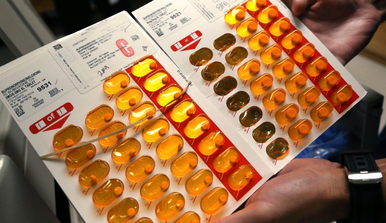 In this July 23, 2018, photo, nurse Brian Toia holds tabs of buprenorphine, a drug which controls heroin and opioid cravings, as he prepares to administer the drug, known also by the brand name Suboxone, to selected inmates at the Franklin County Jail in Greenfield, Mass. 