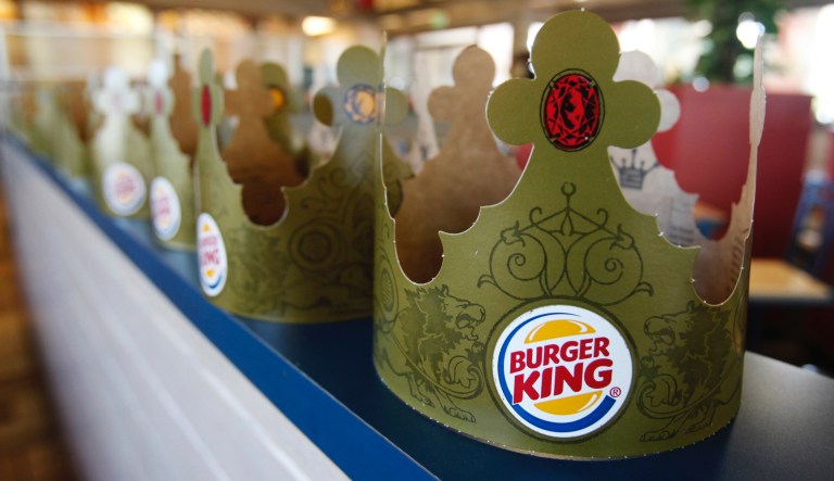 Burger King crowns are on display at Burger King in Mountain View, Calif., Monday, Aug. 23, 2010.  Burger King Holdings Inc. said Tuesday, Aug. 24, its fourth-quarter net income fell nearly 17 percent as sales slipped and ingredient costs climbed.