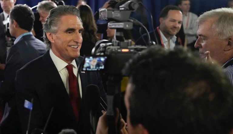 North Dakota Gov. Doug Burgum speaks to reporters in the spin room after a Republican presidential primary debate hosted by FOX News Channel Wednesday, Aug. 23, 2023, in Milwaukee.