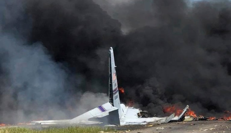 Flames and smoke rise from an Air National Guard C-130 cargo plane after it crashed near Savannah, Ga., Wednesday, May 2, 2018.
