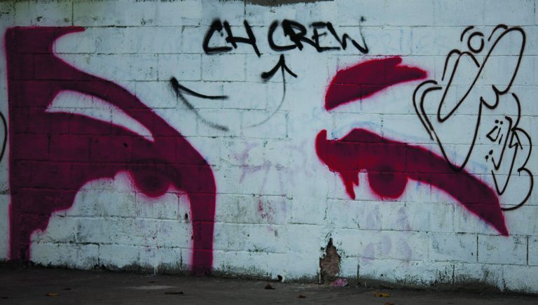 A graffiti depicts an image of the eyes of Venezuela's President Hugo Chavez in Caracas, Venezuela, Tuesday, Dec. 18, 2012. Chavez is recovering in Cuba from a surgery, his fourth operation related to his pelvic cancer since June 2011. (AP Photo/Ariana Cubillos)