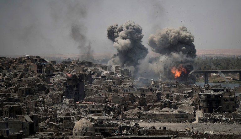 Airstrikes target Islamic State positions on the edge of the Old City in Mosul, Iraq. Iraq said Saturday that its war on the ISIS is over. (AP Photo/Felipe Dana, File)