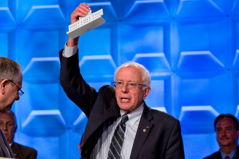 Democratic presidential candidate Sen. Bernie Sanders, I-Vt., holds up a metal work of the U.S. Capitol that he was given as a gift after speaking at the 2015 International Association of Sheet Metal, Air, Rail, and Transportation Workers (SMART) Conference, Tuesday, July 28, 2015, in Washington. (AP Photo/Jacquelyn Martin)