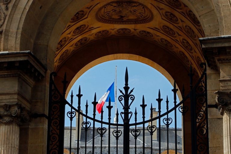 A half staff French flag flies at the Elysee Palace in Paris, France, Monday, July 28, 2014 in a show of respect for the Air Algeria flight crash, that killed all 118 people onboard including 54 French citizens. (AP Photo/Francois Mori )