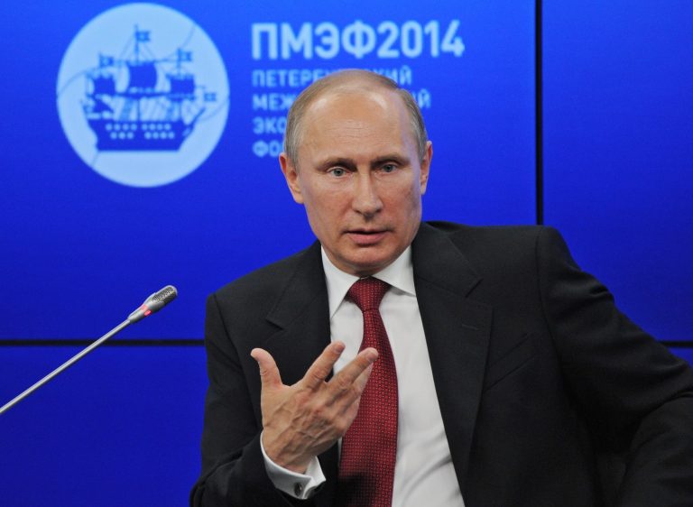 Russian President Vladimir Putin speaks during a plenary session of the St. Petersburg International Investment Forum Friday, May 23, 2014. Putin said Friday at an investment forum that Russia will 