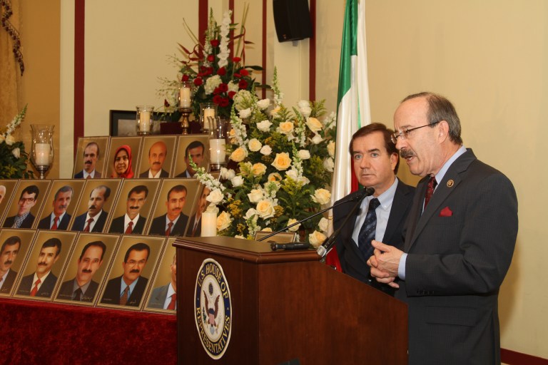 Foreign Affairs Chairman Ed Royce, R-Calif., left, and Foreign Affairs ranking member Eliot Engel, D-N.Y., stand next to a display of portraits of the victims of the Oct. 29 Camp Liberty attack. (Lynn Dykstra, Focused Images)