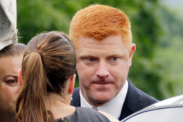   FILE - In this June 12, 2012 file photo, Penn State University assistant football coach Mike McQueary arrives at the Centre County Courthouse in Bellefonte, Pa., to testify in the child sexual abuse trial of former Penn State assistant football coach Jerry Sandusky. A Pennsylvania judge on Thursday, Dec. 20, 2012 denied Penn State's request to put on hold McQueary's whistleblower and defamation lawsuit until related criminal cases are resolved. (AP Photo/Gene J. Puskar, File)  
