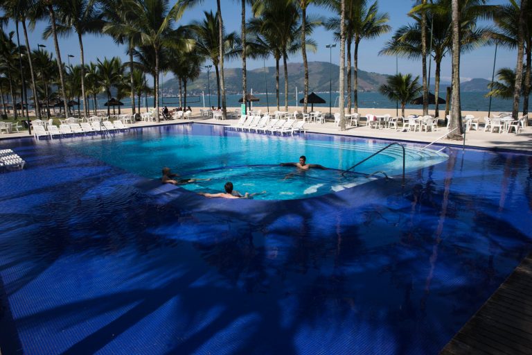 FILE - In this May 8, 2014 file photo, guests wade in the pool at Hotel Portobello where Italy's soccer team will train and reside during the World Cup in Mangaratiba, Brazil. A Brazilian consumer defense agency said Monday, May 26, 2014 it's found past-expiration food at Hotel Portobello as well as the Royal Tulip Hotel where England's team will stay during the World Cup. The Rio de Janeiro state agency said that the inspections were part of an effort to enforce food safety codes ahead of next month's tournament. (AP Photo/Hassan Ammar, File)