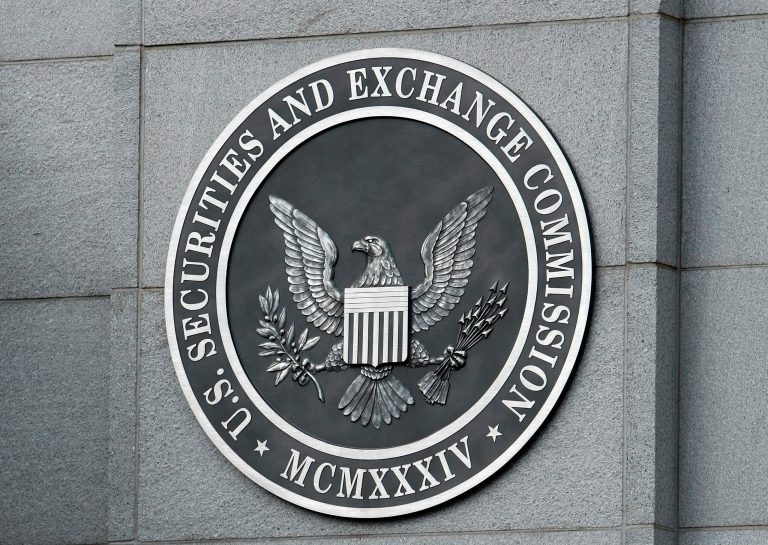 People working for the U.S. Securities and Exchange Commission who owned stock in companies under investigation were more likely to sell shares than other investors in the months before the agency announced it was taking enforcement actions, according to a new academic paper. (Chip Somodevilla/Getty Images)