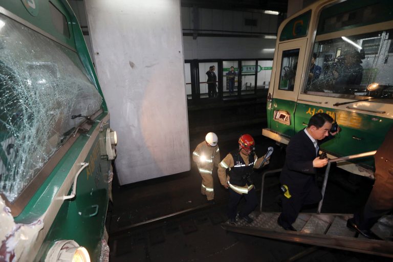 Windows of two subway trains remain broken after their collision at Sangwangshipri subway station in Seoul, South Korea, Friday, May. 2, 2014. A subway train plowed into another train stopped Friday, causing minor injuries for scores of people, a city official said. (AP Photo/Yonhap, Park Dong-ju)  KOREA OUT