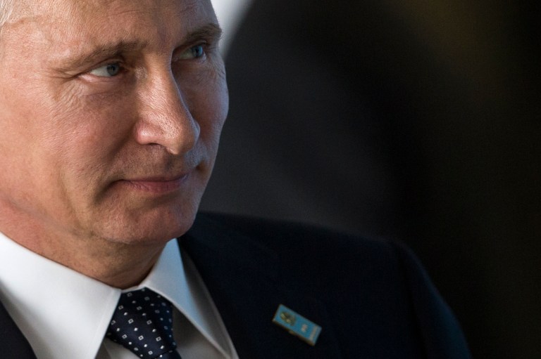Russia's President Vladimir Putin arrives for an official group photo comprised of the leaders of the BRICS' nations and South American nations, during the BRICS Summit at the Itamaraty Palace, in Brasilia, Brazil, Wednesday, July 16, 2014. (AP Photo/Felipe Dana)