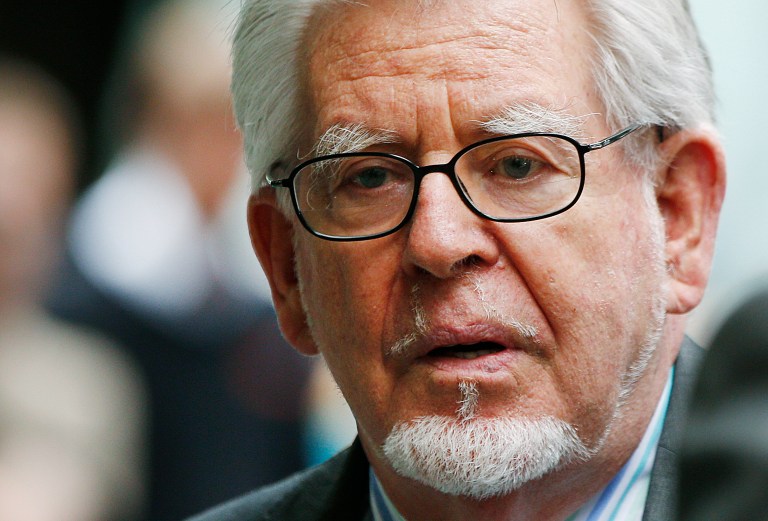 Veteran entertainer Rolf Harris leaves the Southwark Crown Court in London, Monday, June 30, 2014.  A jury Monday found Australian-born Harris guilty of 12 counts of indecent assault.The 84-year-old was convicted of indecent assault on four victims aged 19 or under between 1968 and 1986.  He had denied the charges. (AP Photo/Lefteris Pitarakis)