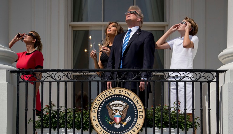 From left, Ivanka Trump, first lady Melania Trump, President Donald Trump, and their son Barron Trump view the solar eclipse,Monday, Aug. 21, 2017, at the White House in Washington. (AP Photo/Andrew Harnik)