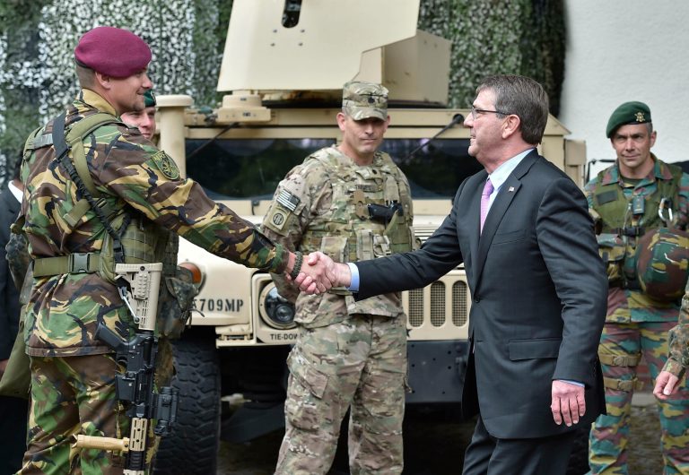 Secretary of Defense Ash Carter, right, shakes hands with NATO Response Force soldiers during his visit to the I. German-Dutch Brigade in Muenster, Germany, Monday, June 22, 2015. The troops are part of NATO's Very High Readiness Joint Task Force. (AP Photo/Martin Meissner)