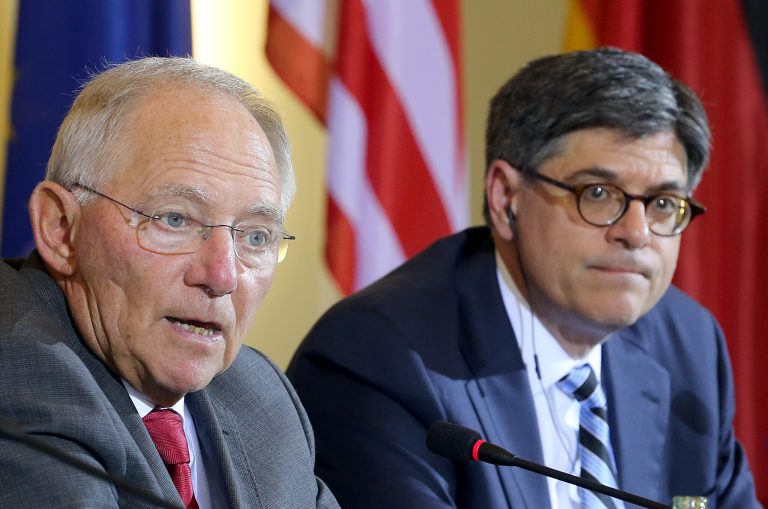 German Finance Minister Wolfgang Schaeuble , left, and US Secretary of the Treasury Jacob Lew  attend a press conference after  a meeting in Berlin, Germany, Thursday June 19, 2014. (AP Photo/dpa, Wolfgang Kumm)