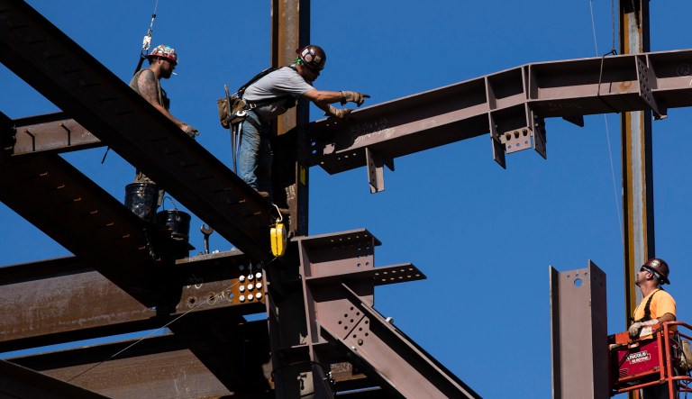 The Department of Commerce said that the U.S. economy grew at a 2.6 percent rate to end 2017. But the tonal variation from four mainstream news outlets on this one fact shows how framing matters. (AP Photo/Matt Rourke)