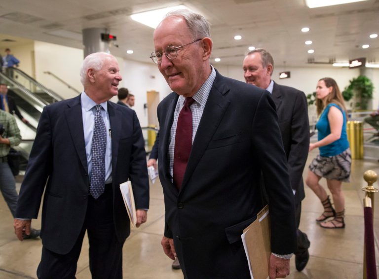 Republican Sens. Lamar Alexander of Tennessee, center, and Pat Roberts of Kansas called on the White House Wednesday to halt the Equal Opportunity Employment Commission's plan to significantly increase the amount of data businesses are required to report to the agency regarding their workforce. (AP Photo/J. Scott Applewhite)