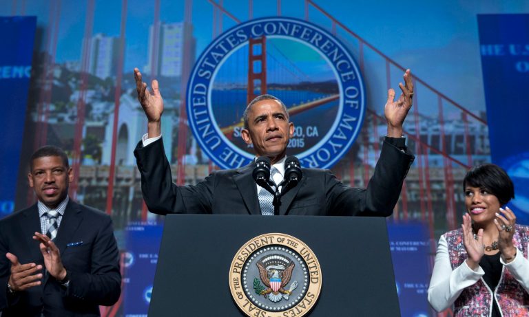 President Barack Obama, joined by Sacramento, Calif., Mayor Kevin Johnson, left, and Baltimore Mayor Stephanie Rawlings-Blake, right, arrives to speak at the Annual Meeting of the U.S. Conference of Mayors in San Francisco, Friday, June 19, 2015. (AP Photo/Carolyn Kaster)