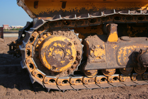 Bulldozer treads creap along