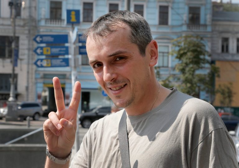 In this Monday, Aug. 11, 2014 photo Denis Lavrienko, 36, gestures during a conversation in Ukraine's capital, Kiev. Since a separatist insurgency broke out in eastern Ukraine in March, entire swaths of Ukrainian society _ either through a government summons or their own patriotism _ have suddenly been thrust into battle, many of them with little or no combat experience. With the government desperate for more fighters and medics, a draft has brought in a wave of needed additions to what had been a neglected army. And amid a surge of patriotic indignation tipping over into martial fervor, volunteer battalions have proven an indispensable boost as well. (AP Photo/Efrem Lukatsky)