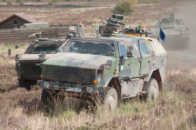 FILE - In this Aug. 28, 2009 file picture  a German armored infantry vehicle  Dingo takes part in a combat training  in Letzlingen, eastern Germany. Germany joins other European countries who have pledged to provide arms to the Kurds fighting the Islamic State group that has swept into northern Iraq in recent months.  In total, the shipments will include 8,000 G36 assault rifles and the same number of G3 rifles, as well as ammunition; 200 Panzerfaust 3 and 30 MILAN anti-tank systems; and five heavily armored Dingo infantry vehicles. Chancellor Angela Merkel has told German lawmakers Monday Sept.1, 2014 that arming Kurdish fighters battling Islamic extremists in Iraq wasn't an easy decision but is in her country's interest.   (AP Photo/Eckehard Schulz,File)