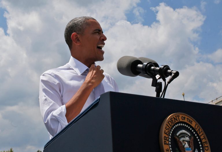 President Obama loosens his tie as he speaks about transportation and the economy at the Georgetown Waterfront Park in Washington, Tuesday, July 1, 2014.(AP Photo/Charles Dharapak)