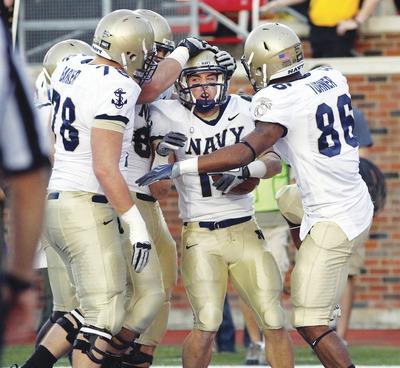 John F. Rhodes/AP
The Navy offense threw only two passes and completed none but ran the ball well in a 24-17 win over SMU on Saturday.