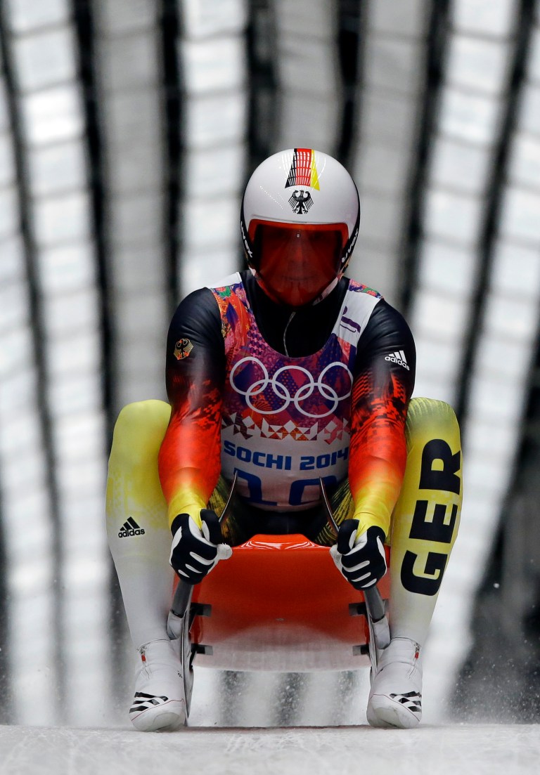 Felix Loch of Germany brakes after finishing his second run during the men's singles luge competition at the 2014 Winter Olympics, Saturday, Feb. 8, 2014, in Krasnaya Polyana, Russia. (AP Photo/Dita Alangkara)